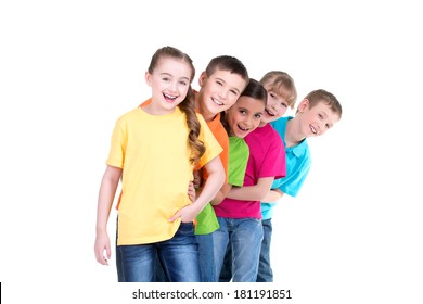 Group Of Happy Children In Colorful T-shirts Stand Behind Each Other On White Background.