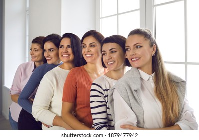 Group Of Happy Confident Young Women In Their 20s And 30s Standing Close To Each Other, Smiling And Looking Away Together. Female Team, Success, Positive Outlook For Future, Unity And Support Concepts