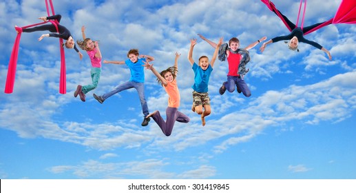  Group happy dancing jumping and aerial silks performing together children in blue sky. Photo collage. Childhood, active lifestyle, sports and happiness concept.           - Powered by Shutterstock