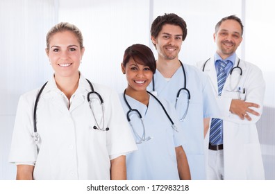 Group Of Happy Doctors Standing In A Row With Stethoscope