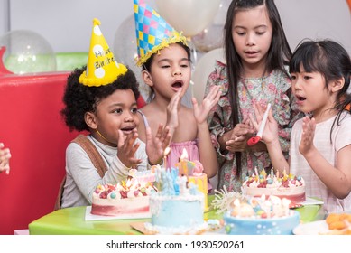 Group of  happy and enjoy kids have fun celebrating her birthday with Multinational friend kids birthday celebratiion party.