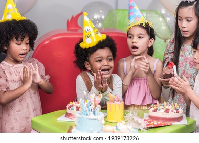 Group of  happy and enjoy kids have fun celebrating her birthday with Multinational friend kids birthday celebratiion party.