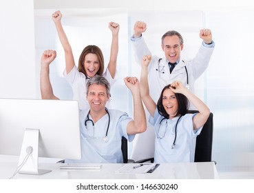 Group Of Happy Excited Doctor Raising Arm