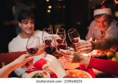 Group Of  Happy Family Enjoying Celebrating Christmas Or New Year's Eve Party With Champagne At Home. Eve Family Gathering Meeting Dream In Christmas Or New Year Festivals.