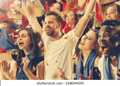 Group of happy fans are cheering for their team victory. Collage made of 8 models. - Shutterstock ID 1348549295