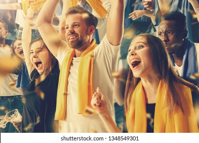 Group of happy fans are cheering for their team victory. Collage made of 8 models. - Shutterstock ID 1348549301