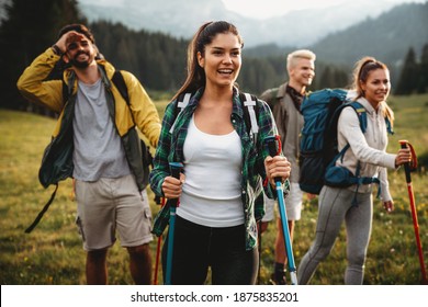 Group Of Happy Fit Friends Hiking, Trekking Together Outdoor Nature