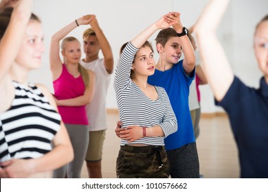 Group Of Happy French Teen Dancing Salsa In Dance Studio