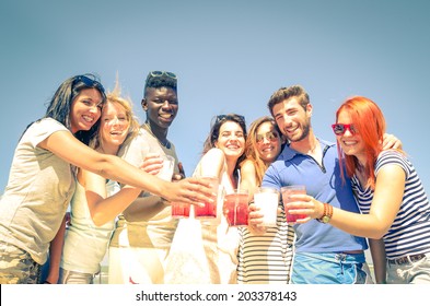 Group of happy friends drinking cocktails - Powered by Shutterstock