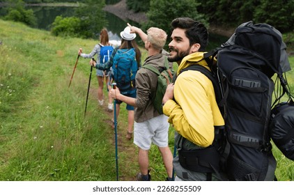 Group of happy friends enjoying outdoor activity together - Powered by Shutterstock