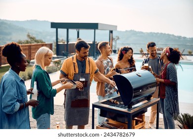Group of happy friends enjoying in preparing barbecue at pool party.