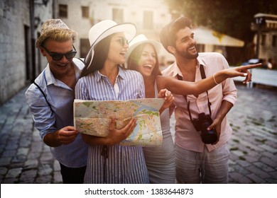 Group Of Happy Friends Enjoying Sightseeing Tour In The City.