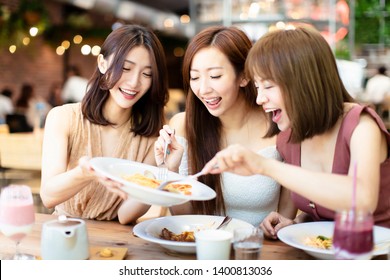 Group of Happy friends having dinner in the restaurant - Powered by Shutterstock