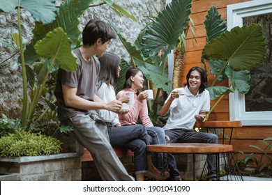 Group of happy friends having fun in the garden,trendy young people enjoying time together