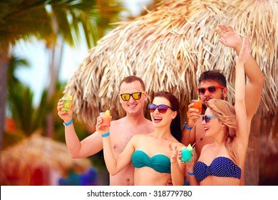 Group Of Happy Friends Having Fun On Tropical Beach, Summer Holiday Party