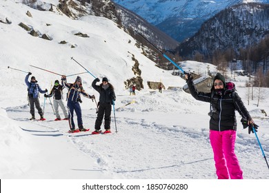 Group Of Happy Friends In The Mountains Snowshoeing