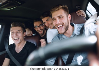 Group Of Happy Friends On A Car