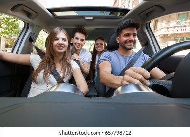 Group Of Happy Friends On A Car