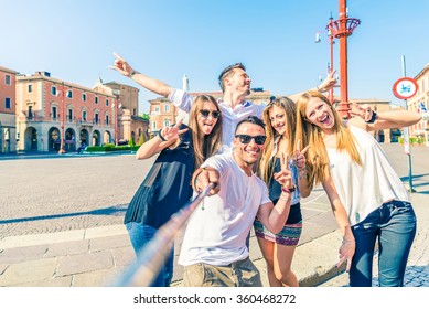 Group Of Happy Friends Taking A Selfie With Stick Outdoors - Concept Of Young People Having Fun And Using New Communication Technologies