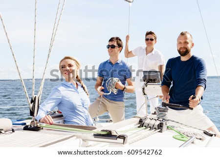 Group of happy friends traveling on a yacht. Tourism, vacation, holiday, concept.