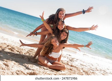 Group Of Happy Girl Teens At The Beach