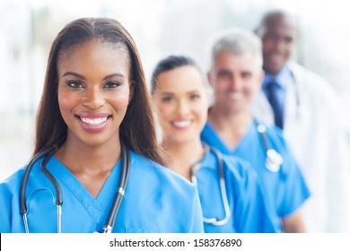 group of happy healthcare workers line up