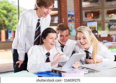 Group Of Happy High School Students Using Tablet Computer