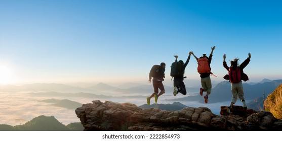 Group of happy hiker jumping on the hill. hiking holiday, wild adventure