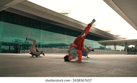 Group of happy hipster or street dancer doing freeze pose in front of mall. Funny energetic break dancer practice b-boy step dancing with friends. Outdoor sport 2024. Street dancer concept. Sprightly. - Powered by Shutterstock