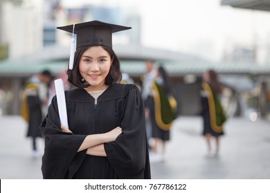 Group of Happy International Students in Bachelor Gowns with Diplomas, Education.  Graduation and People concept, - Powered by Shutterstock