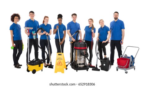 Group Of Happy Janitors With Cleaning Equipment