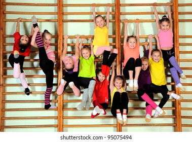 Group of happy kids in the gym