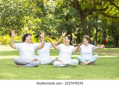 Group of happy mature indian  people wearing white outfit laughing relaxing doing yoga together outdoor at summer park.  Retirement life. Mental health and fitness, Stress free,  Fun activity.  - Powered by Shutterstock