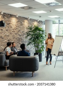 Group Of Happy Multi-Ethnic Businesspeople In A Casual Meeting At Work.

Group Of Entrepreneurs Sitting On Couch In A Business Meeting At Their Company And Listening Presentation Carefully.