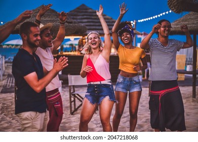 Group Of Happy Multiracial Friends Dancing At Sunset Beach Party In Summer Vacation - Young Millennials People Having Fun At Weekend In The Outdoor  Club - Youth Lifestyle And Nightlife Concept