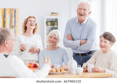 Group Of Happy Older People Laughing Together On A Meeting