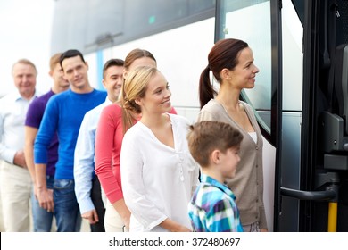 group of happy passengers boarding travel bus - Shutterstock ID 372480697
