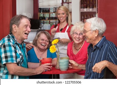 Group Of Happy People At Cafe With Waitress