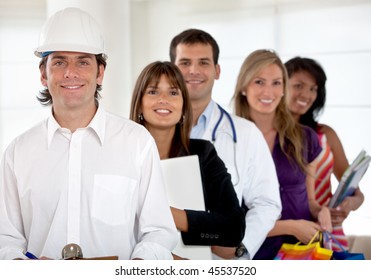Group of happy people with different professions indoors