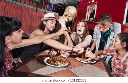 Group of happy people eating out at mobile restaurant - Powered by Shutterstock