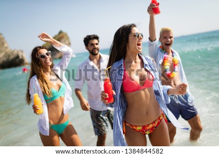 Group of happy people having fun at summer. Beach vacation friends travel concept