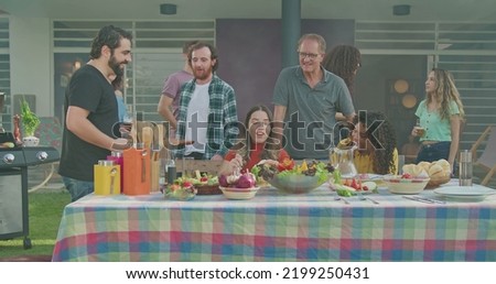 Similar – Gruppe von Freunden, die bei einem Sommergrill kochen.