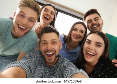 Group Of Happy People Taking Selfie In Office