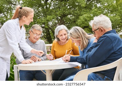 Group of happy senior friends solving crossword puzzle and maze in garden of nursing home0 - Powered by Shutterstock