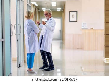 Group of happy smile professional medical doctor team with stethoscope in uniform working discussing and talk at hospital.health medical care concept