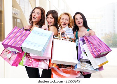 Group Of Happy Smiling Women Shopping With Colored Bags