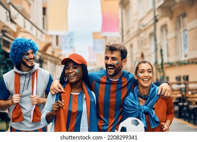 Group Of Happy Soccer Fans Celebrating Favorite Team's Victory On The Street During The World Cup.