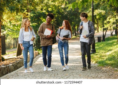 Group Of Happy Students Walking At The Campus Outdoors