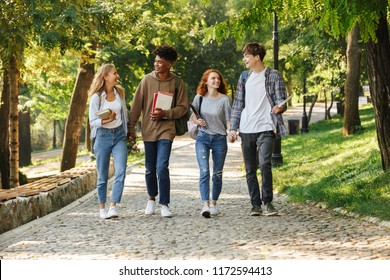 Group Of Happy Students Walking At The Campus Outdoors, Talking