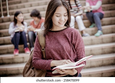 Group Of Happy Teen High School Students Outdoors